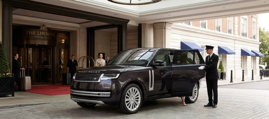 Luxury airport transfer Dubai SUV at hotel entrance